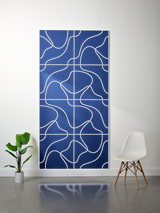 Blue felt sheet with white engraved topographic contour lines in grid pattern.