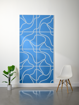 Blue felt sheet with cream-colored engraved topographic line pattern divided into rectangular sections.