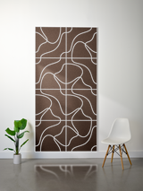 Brown felt sheet with white engraved topographic line pattern in grid layout.