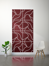 Burgundy felt sheet with white engraved topographic line pattern in grid layout.