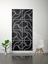Black felt sheet with white engraved topographic line pattern arranged in grid sections.