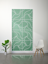 Green felt sheet with cream-colored topographic line engraving in geometric grid pattern.