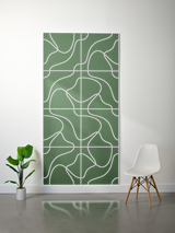 Thick green felt sheet with white engraved topographic line pattern forming a grid of abstract contour shapes.