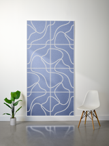 Blue felt sheet with cream-colored engraved topographic line pattern and grid divisions.