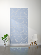 Blue felt sheet with cream-colored engraved topographic line pattern divided into rectangular sections.