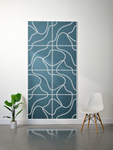 Teal felt sheet with white engraved topographic line pattern divided into grid sections.