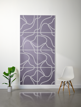 Purple felt sheet with white engraved topographic contour line pattern in grid sections.