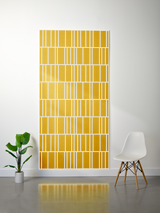 Yellow felt sheet with white engraved lines in offset rectangular pattern arrangement.
