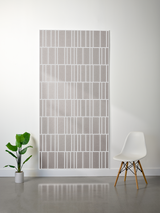 Thick felt sheet with offset engraved vertical and horizontal lines in rectangular grid pattern, light gray color.