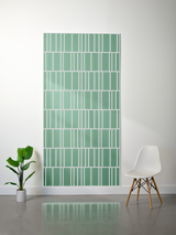 Green felt sheet with white engraved vertical lines in offset pattern arrangement.