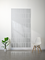Thick white felt sheet with offset engraved grid pattern creating layered rectangular sections.
