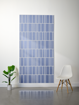 Blue felt sheet with white engraved vertical stripe pattern in offset rows.