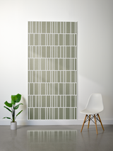 Sage green felt sheet with white engraved vertical and horizontal line pattern in offset rows.