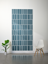 Teal felt sheet with offset white vertical and horizontal engraved lines creating a geometric grid pattern.