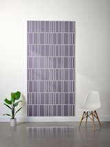 Lavender-gray felt sheet with white engraved offset rectangular pattern displayed on wall.