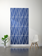 Blue felt sheet with white engraved wavy line pattern in four horizontal sections.