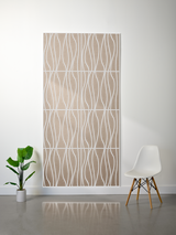 Beige felt sheet with white wavy linear engraved pattern, displayed on wall showing layered texture and grid divisions.