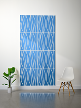 Blue felt sheet with white engraved wavy line pattern in four layered sections.