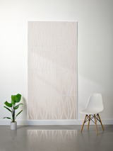Beige layered felt sheet with white wavy engraved lines pattern, divided into four sections.