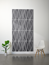 Thick gray felt sheet with white wavy line engraving pattern arranged in rectangular sections.