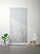 Light gray felt sheet with engraved wavy vertical line pattern creating layered depth effect.