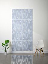 Blue-gray felt sheet with white engraved wavy lines in repeating pattern, displayed as four stacked panels.