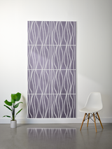 Purple felt sheet with white engraved wavy vertical line pattern divided into rectangular sections.