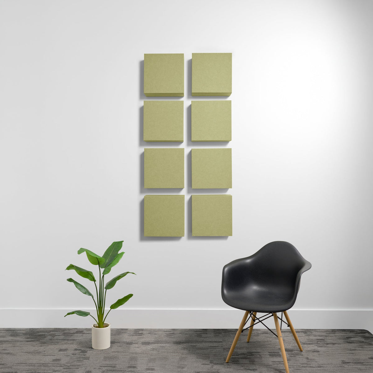 Eight sage green square acoustic panels arranged in a 2x4 grid on white wall.