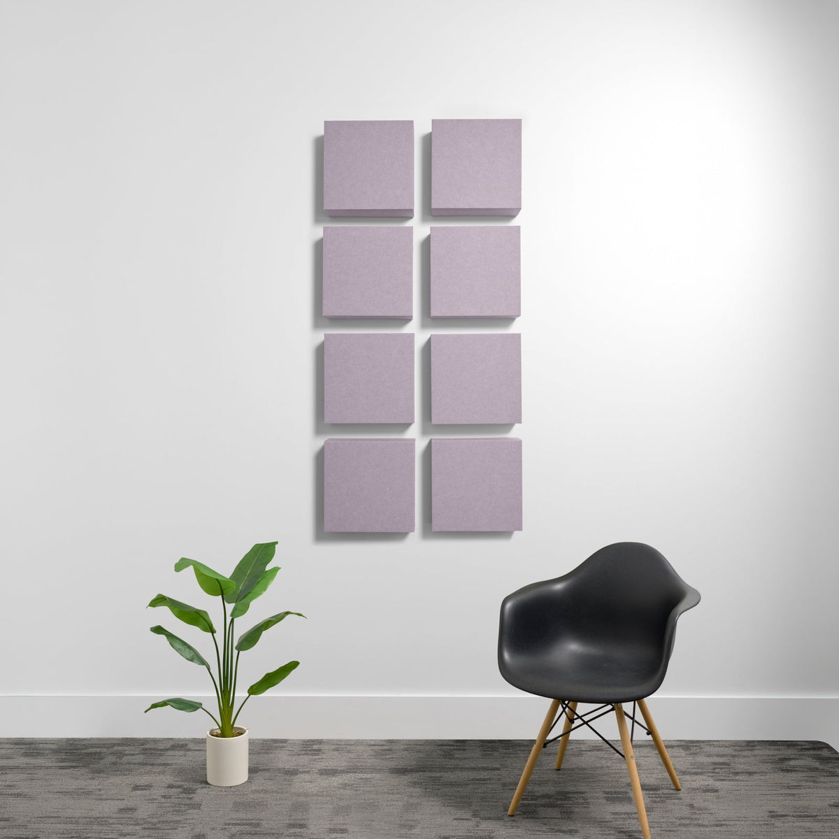 Eight mauve square acoustic panels arranged in a grid pattern on a white wall.