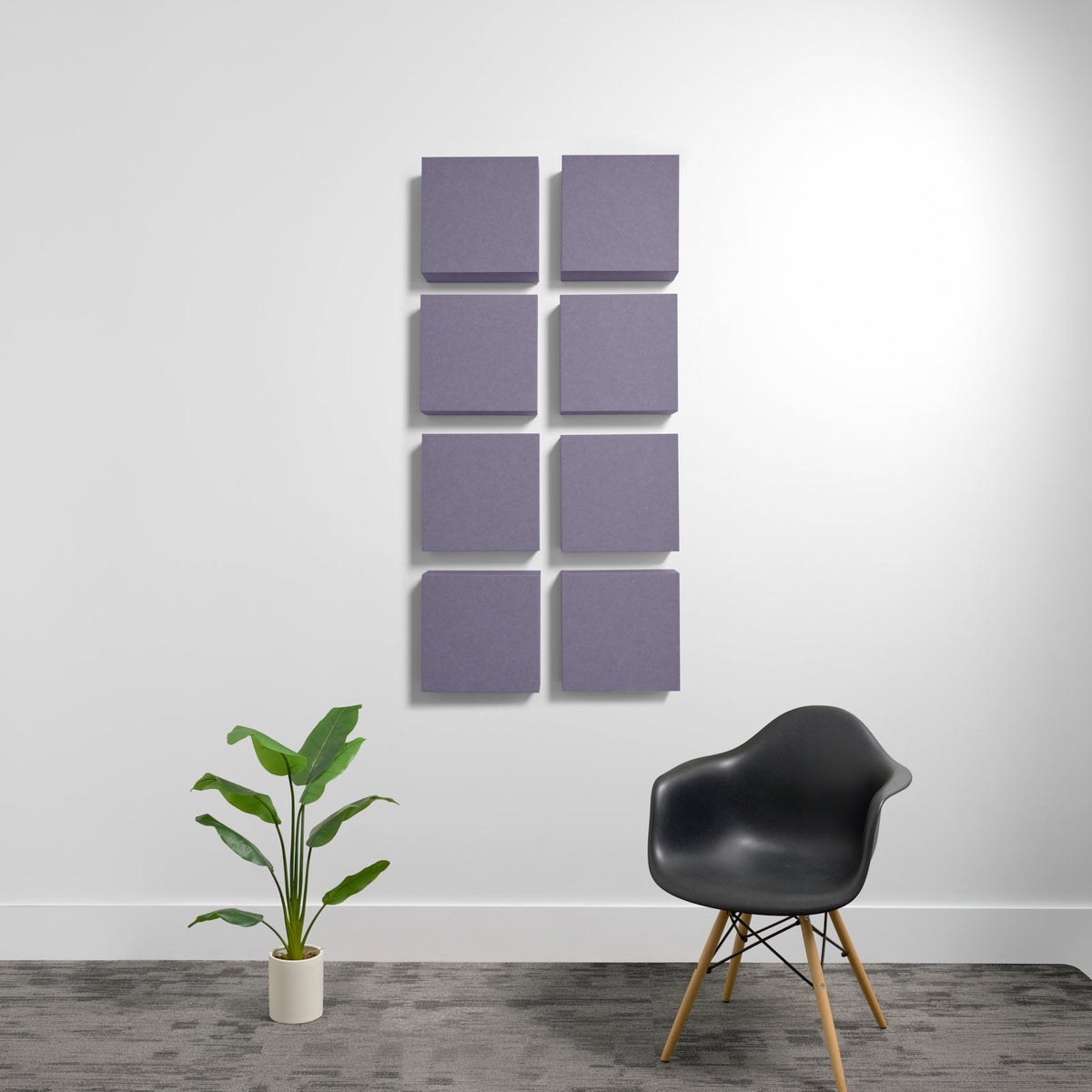 Eight purple square acoustic panels arranged in a 2x4 grid on a white wall.