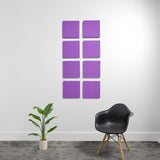 Eight purple square acoustic panels mounted on white wall in 2x4 grid arrangement.
