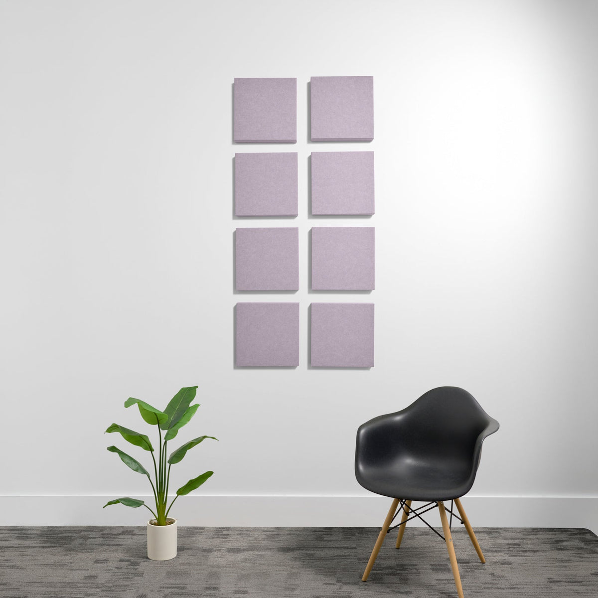 Eight purple square acoustic panels arranged in two columns on a white wall.