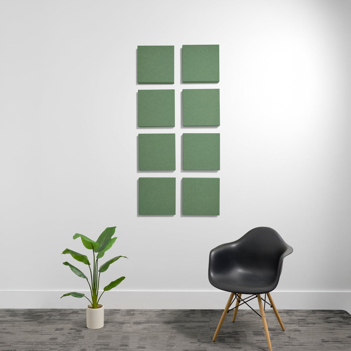 Eight sage green 3D acoustic panels arranged in a 2x4 grid on a white wall.