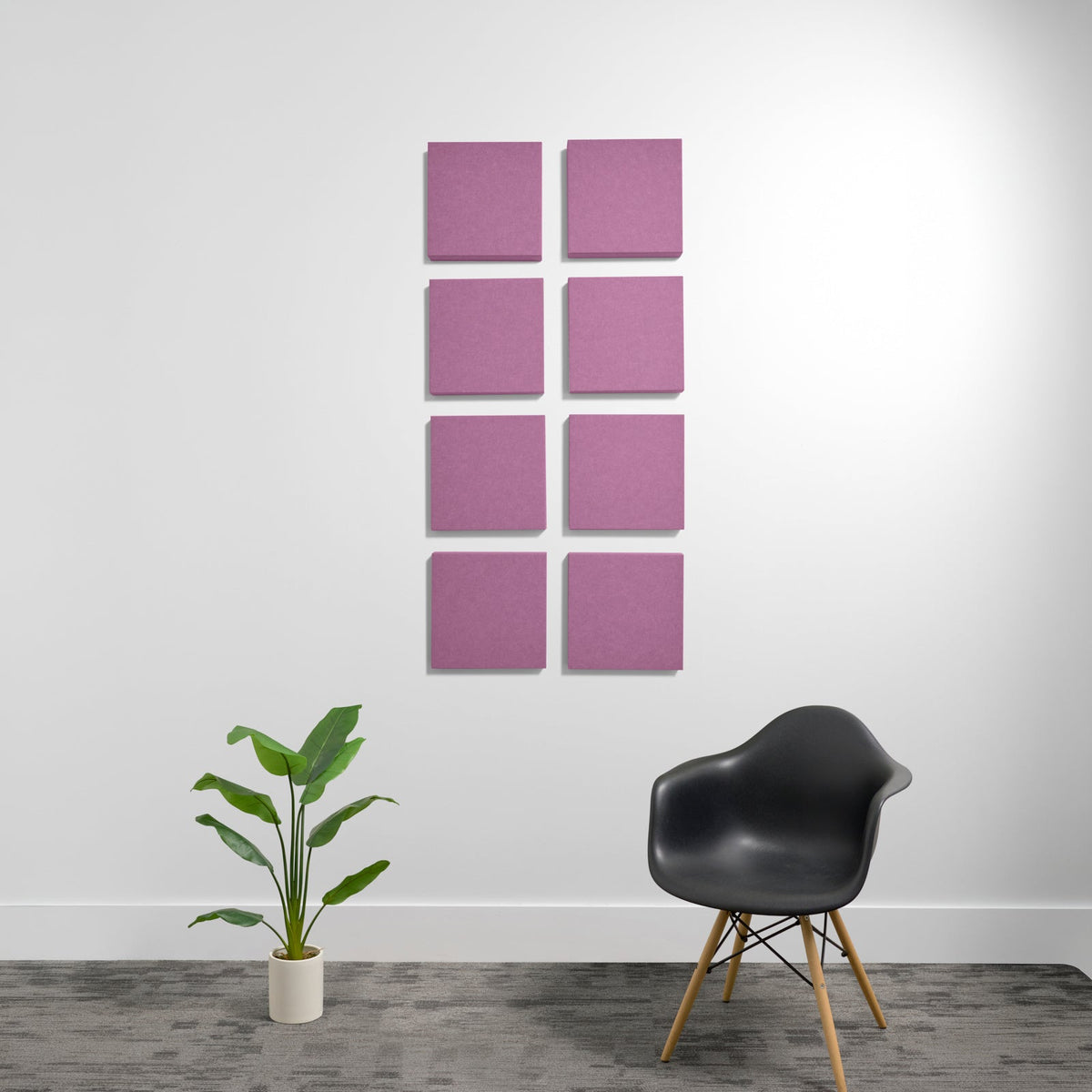Eight mauve-pink square acoustic panels mounted on white wall in 2x4 grid arrangement.