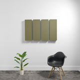 Four rectangular olive-green acoustic panels mounted on white wall above black chair and potted plant.