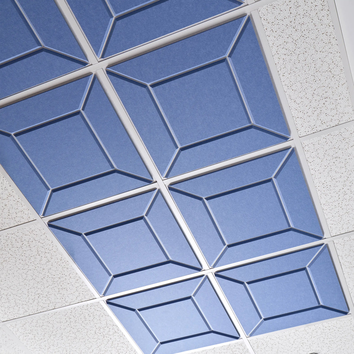 Blue Facet felt drop ceiling tiles with beveled diamond patterns in a ceiling grid