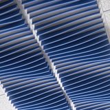 Close-up of blue Ripple felt drop ceiling tiles with deep 3D wave fins