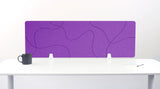 Purple desk divider with topographic line pattern mounted on white desk supports.