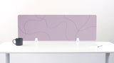 Lavender desk divider with curved line pattern, mounted on white desk with white brackets.