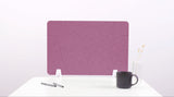 Purple desk divider with curved topographic pattern and white mounting brackets on white desk surface.