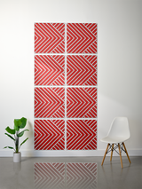 Eight red and white tiles with diagonal striped chevron pattern arranged in a 2x4 grid on wall.