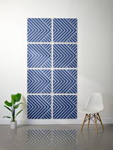 Eight square tiles with navy blue background and white diagonal striped chevron pattern arranged in a grid.