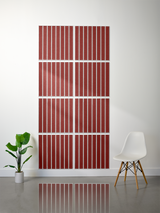 Eight red tiles with white parallel line engraving arranged in a 2x4 grid on a wall.