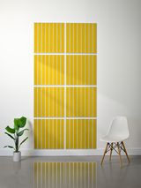 Set of eight yellow tiles with white parallel line engravings arranged in a 2x4 grid on a wall.