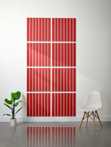 Eight red tiles with white vertical engraved lines arranged in a 2x4 grid on a wall.