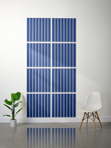 Eight blue tiles with white vertical parallel line engravings arranged in a 2x4 grid on a wall.