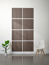 Eight brown tiles with vertical parallel engraved lines arranged in a 2x4 grid on a wall.