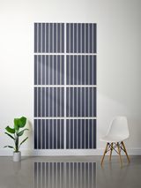 Eight dark blue tiles with white parallel vertical line engravings arranged in a 4x2 grid on a wall.