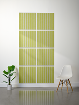 Eight olive-green tiles with white parallel line engravings arranged in a 2x4 grid pattern on a wall.