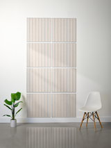 Eight beige tiles with parallel vertical engraved lines arranged in a 2x4 grid on a wall.